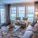 living room with multiple windows and a patio door