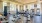 fitness center rendering showing plenty of equipment and modern decor in a large, spacious room