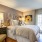 bedroom with modern decor, patio doors and large open spaces