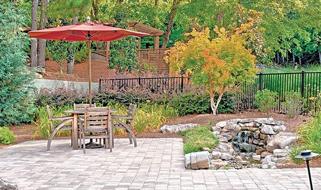 Stylish Interiors spacious outside seating with lush landscaping